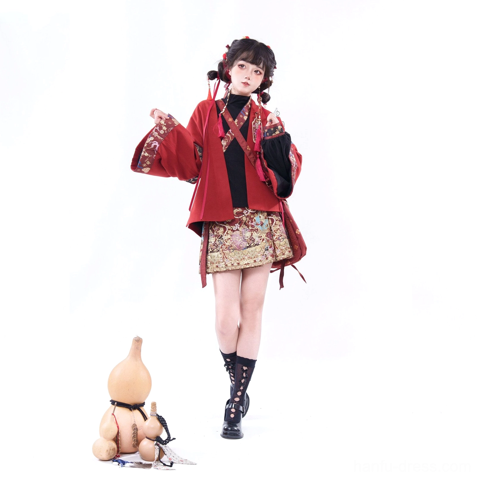 Modern Chinese New Year Hanfu dress with cross-collar styling, red tassel decorations, and embroidered short skirt hem