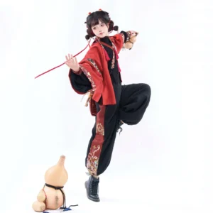 Modern Chinese New Year Hanfu outfit with embroidered black wide-leg pants, red tassel details, and traditional festive styling