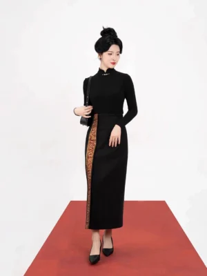 Three-quarter view of a modern Chinese-style black stand-collar top and embroidered high-waisted long skirt Hanfu set