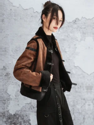 Three-quarter view of a contemporary Chinese-style faux fur Hanfu jacket showing the cropped silhouette, soft inner lining, shoulder straps, and black handbag styling
