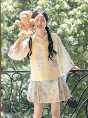 Modern Chinese style Hanfu outfit with bear print yellow vest, sheer bell sleeves, and light blue pleated mini skirt