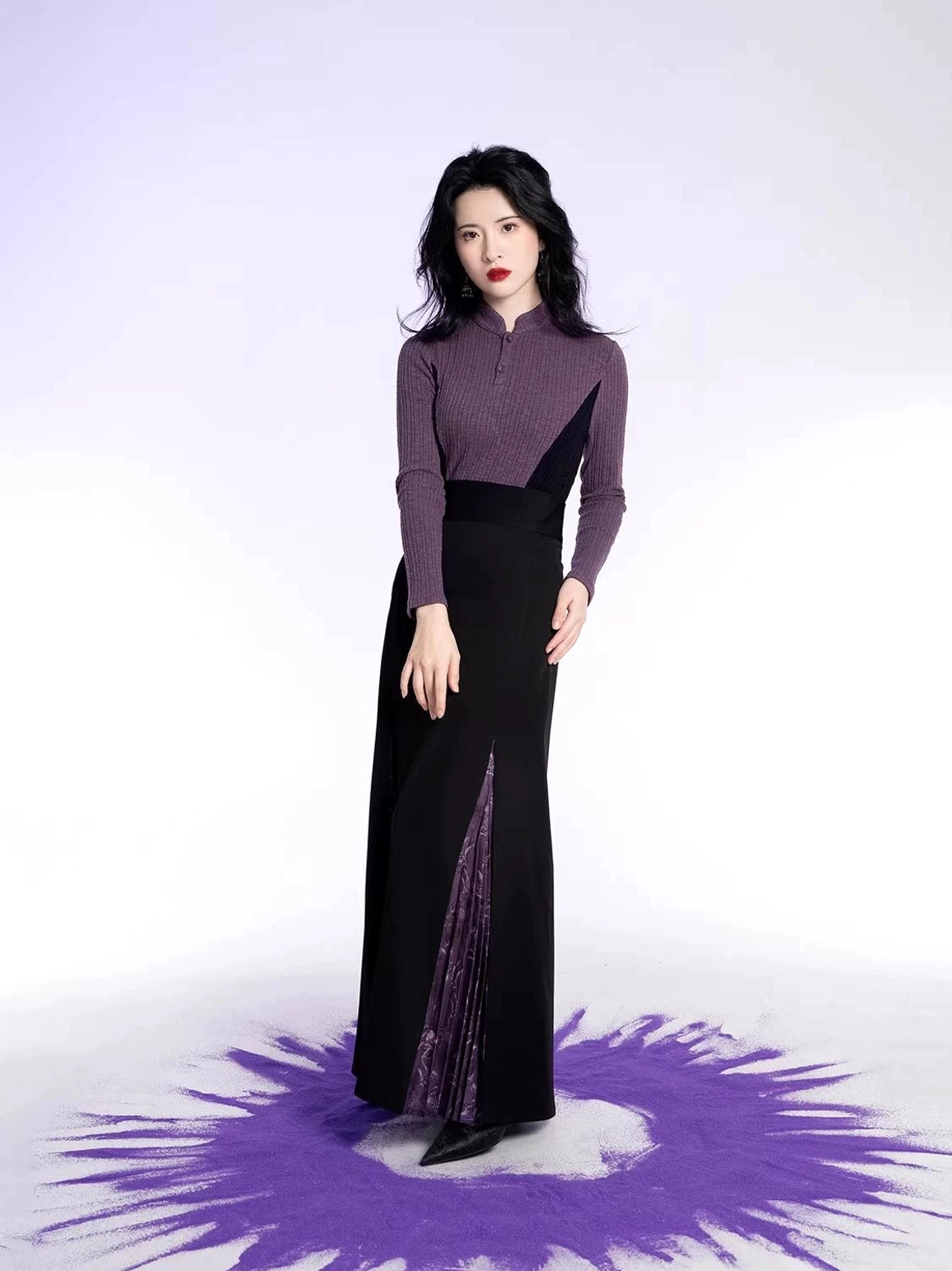 Modern Chinese style outfit featuring a dark purple ribbed stand collar knit top and high waist black skirt with purple pleated side slits