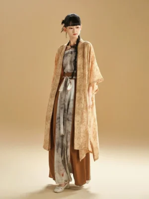 Full-length front view of a woman wearing a modern Chinese style summer Hanfu three-piece outfit with a dusty yellow tie-dye cardigan and ink-wash layered clothing