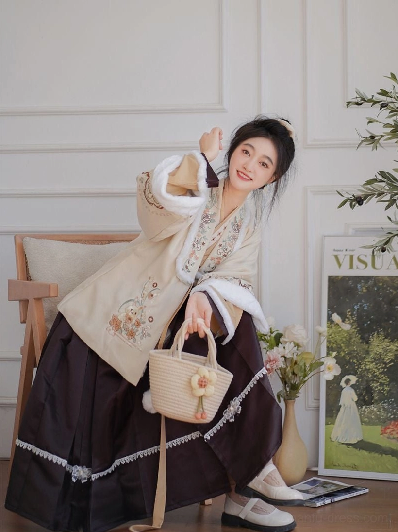 Modern embroidered Hanfu set styled with a woven straw handbag, beige cardigan, floral sleeve embroidery, white lace skirt hem, and fluffy decorative details