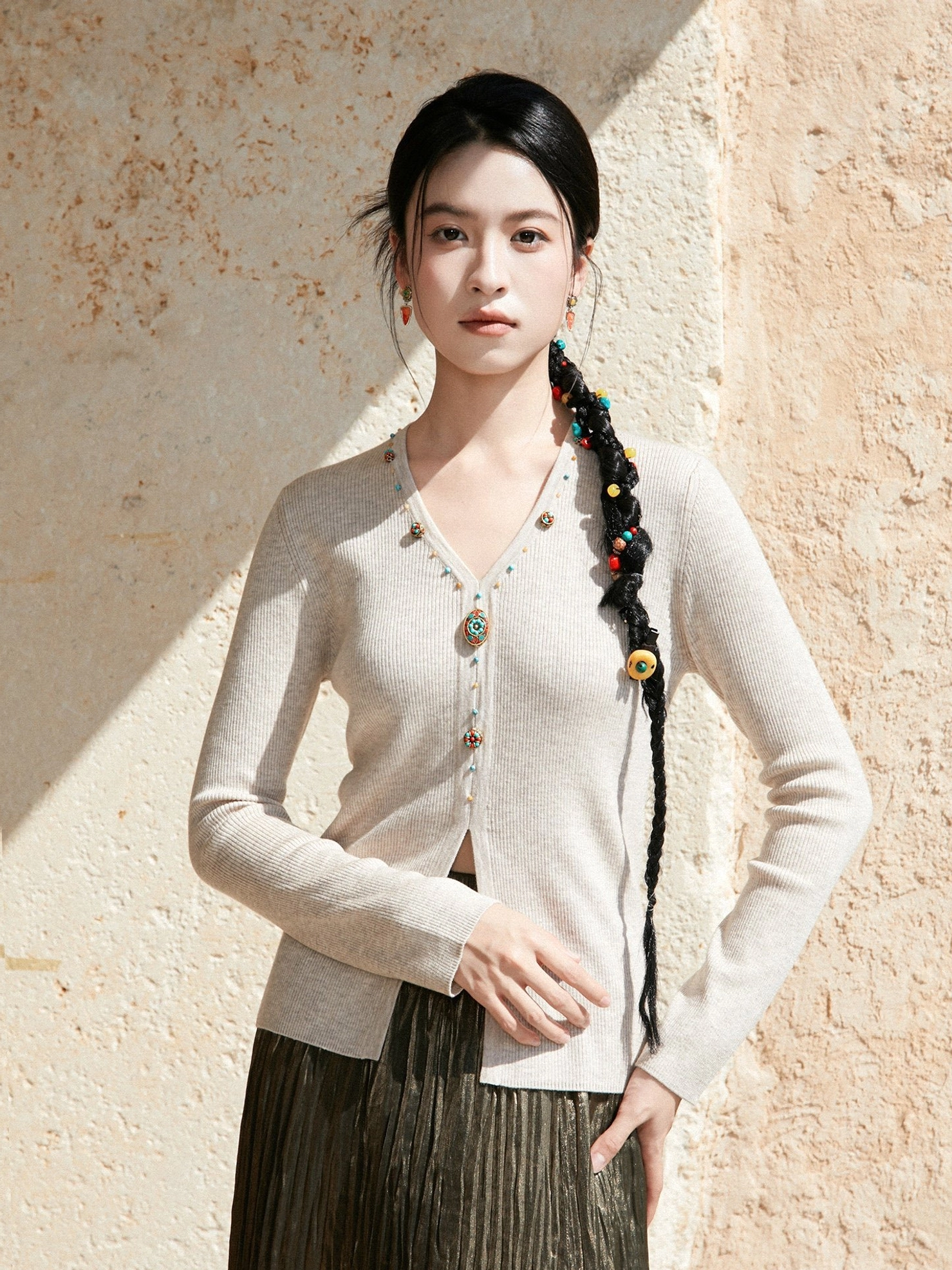Apricot beige modern Hanfu V-neck cashmere-blend knit sweater with jewel buttons styled with a dark brown pleated skirt