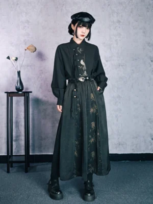 Full front view of a modern Hanfu bamboo print high-waisted maxi skirt styled with a dark embroidered blouse, leather belt, lantern sleeves, and black beret