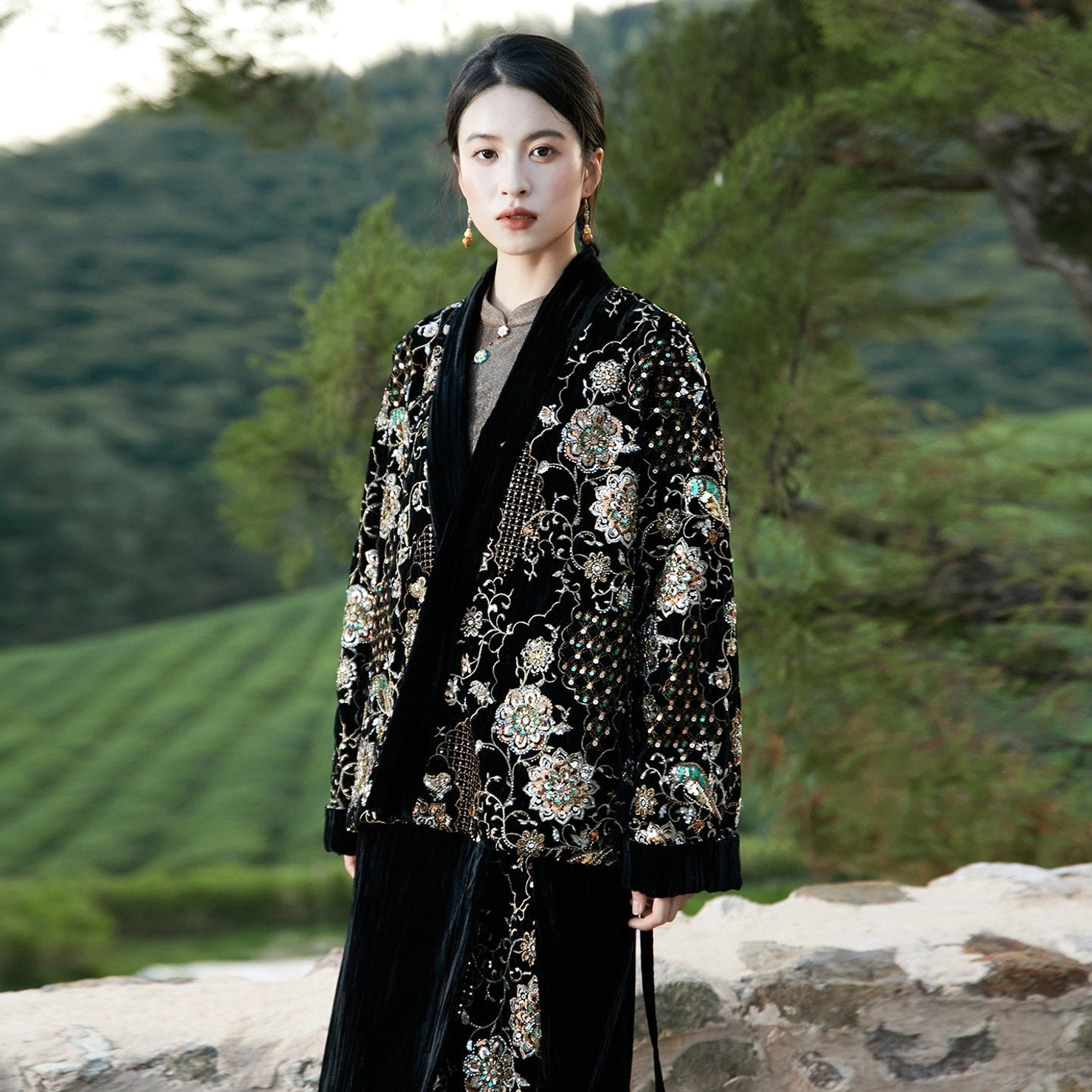 Black oversized modern Hanfu jacket with ornate gold floral bead embroidery, velvet collar trim, cuffs, and wool-padded construction