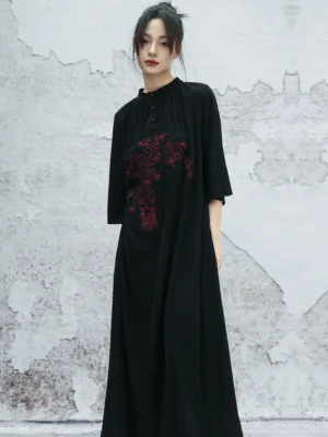 Front full-body view of a modern Hanfu black embroidered maxi dress with stand collar, half-button placket, red floral chest embroidery, three-quarter sleeves, and loose straight silhouette