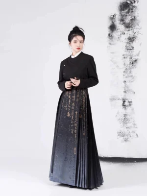 Side view of a contemporary Chinese Hanfu outfit featuring a fitted black jacket and pleated gradient mamian skirt with golden calligraphy