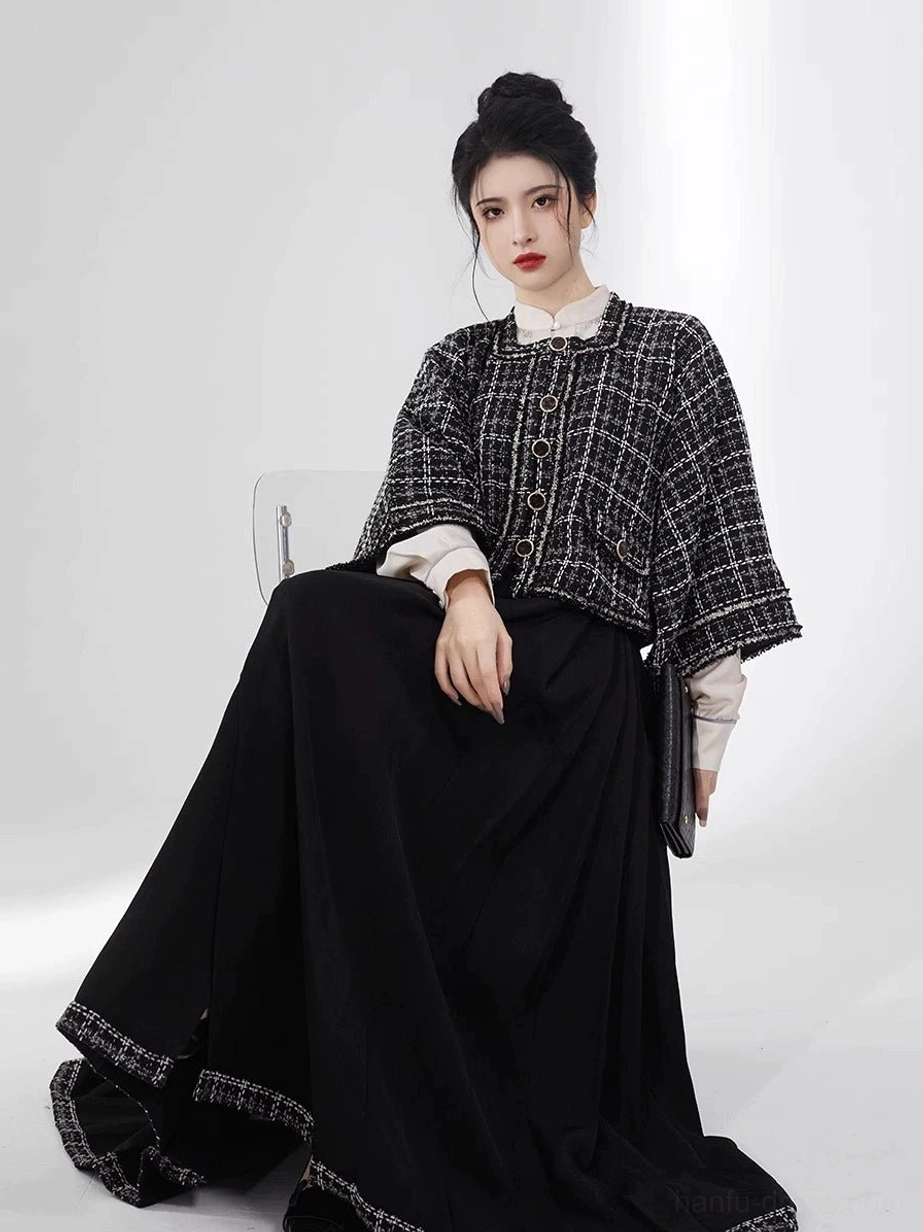 Black tweed-look cropped modern Hanfu jacket with black floor-length pleated mamianqun skirt seated view