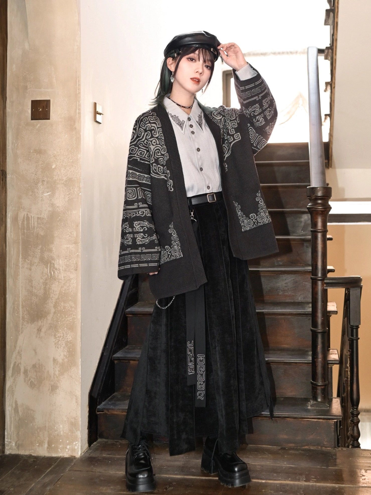Full-body styling of a black modern Hanfu bronze pattern cardigan paired with a white button-up shirt, long black velvet skirt, leather beret, and platform shoes