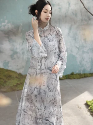 Front three-quarter view of a modern Hanfu cheongsam dress with ink bamboo and Chinese calligraphy print, stand mandarin collar, flowing bell sleeves, and floor-length silhouette