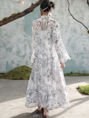 Back view of a modern Chinese-style cheongsam dress with tonal ink-wash print, flowing floor-length skirt, long sheer sleeves, and elegant contemporary Hanfu design