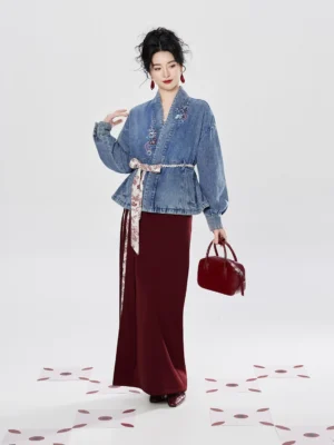 Front view of a woman wearing a Modern Hanfu denim jacket, burgundy camisole and long floral-panel wrap skirt set