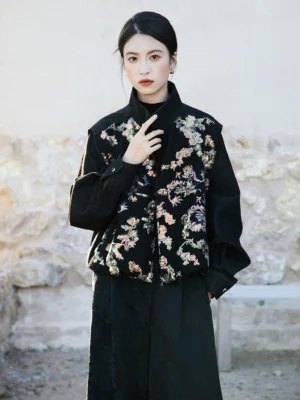 Close front view of a Chinese style dragon sequin jacket showing colorful dragon and floral embellishment, relaxed oversized fit, stand collar, and buttoned cuffs