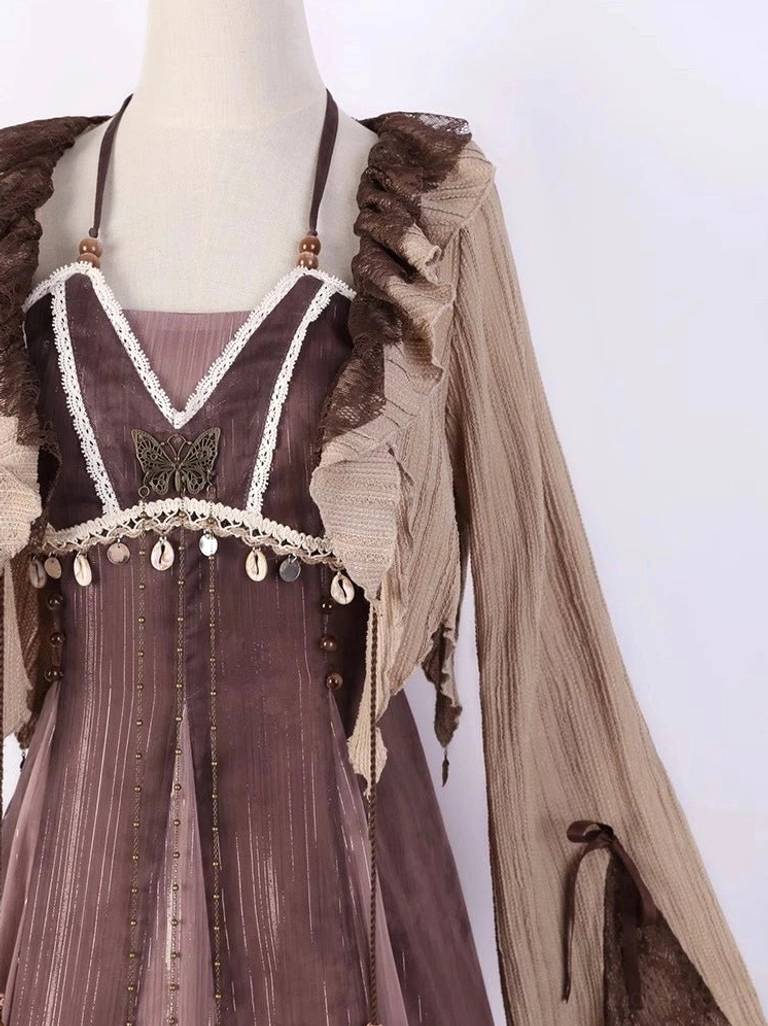 Close-up mannequin view of a modern Hanfu dress set showing lace-trimmed neckline, butterfly embroidery, shell pendant details, and ruffled cardigan
