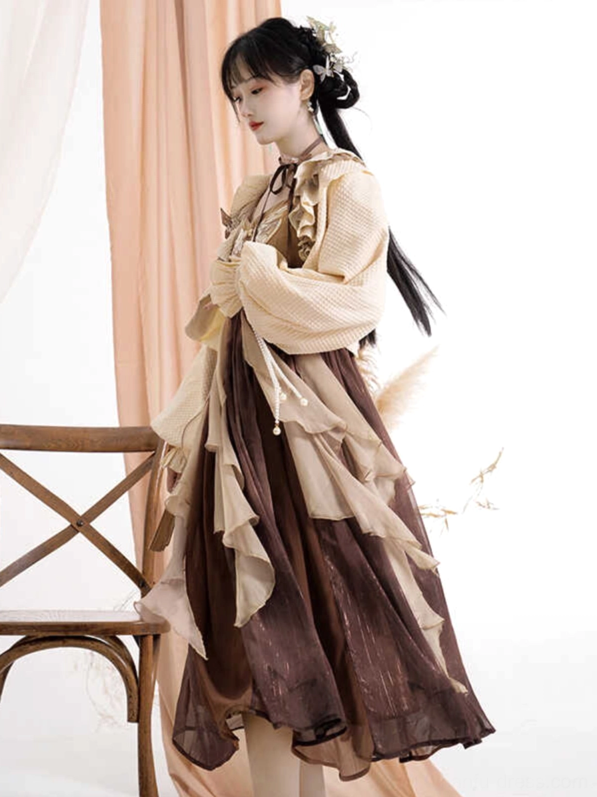 Side view of a flowing modern Hanfu dress and ruffled cardigan with layered chiffon skirt and traditional Chinese inspired styling