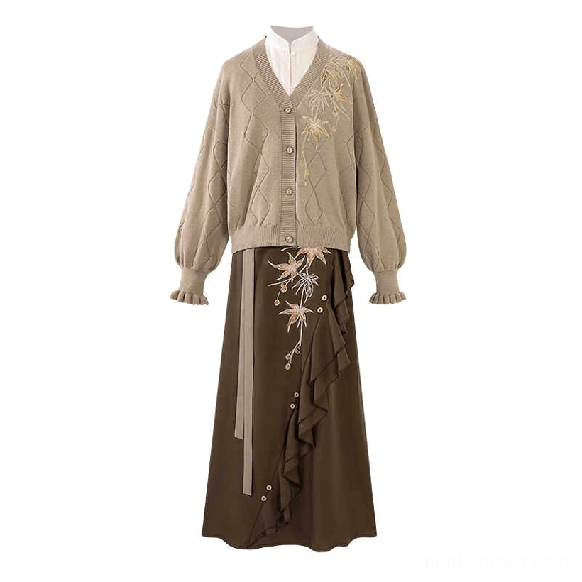 Flat lay display of the complete modern Hanfu three piece outfit including taupe knit cardigan cream long sleeve top and brown maple leaf skirt