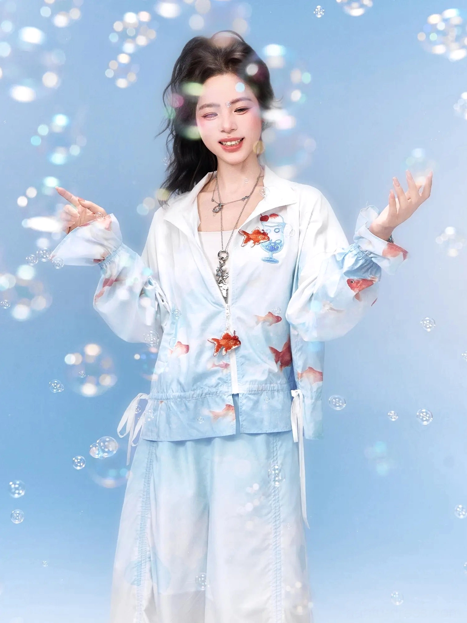 Modern Hanfu goldfish print two-piece outfit with cropped hooded jacket, flowing wide-leg pants, and sheer layered styling detail