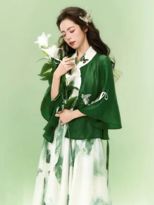 Modern Hanfu two-piece outfit side view with dark green embroidered outer coat and flowing printed dress