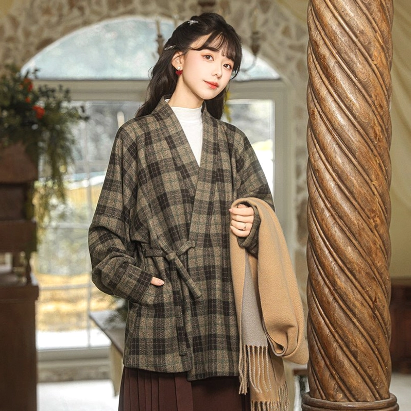 Modern Hanfu green plaid cross-collar jacket half body view showing adjustable wrap tie and practical side pocket