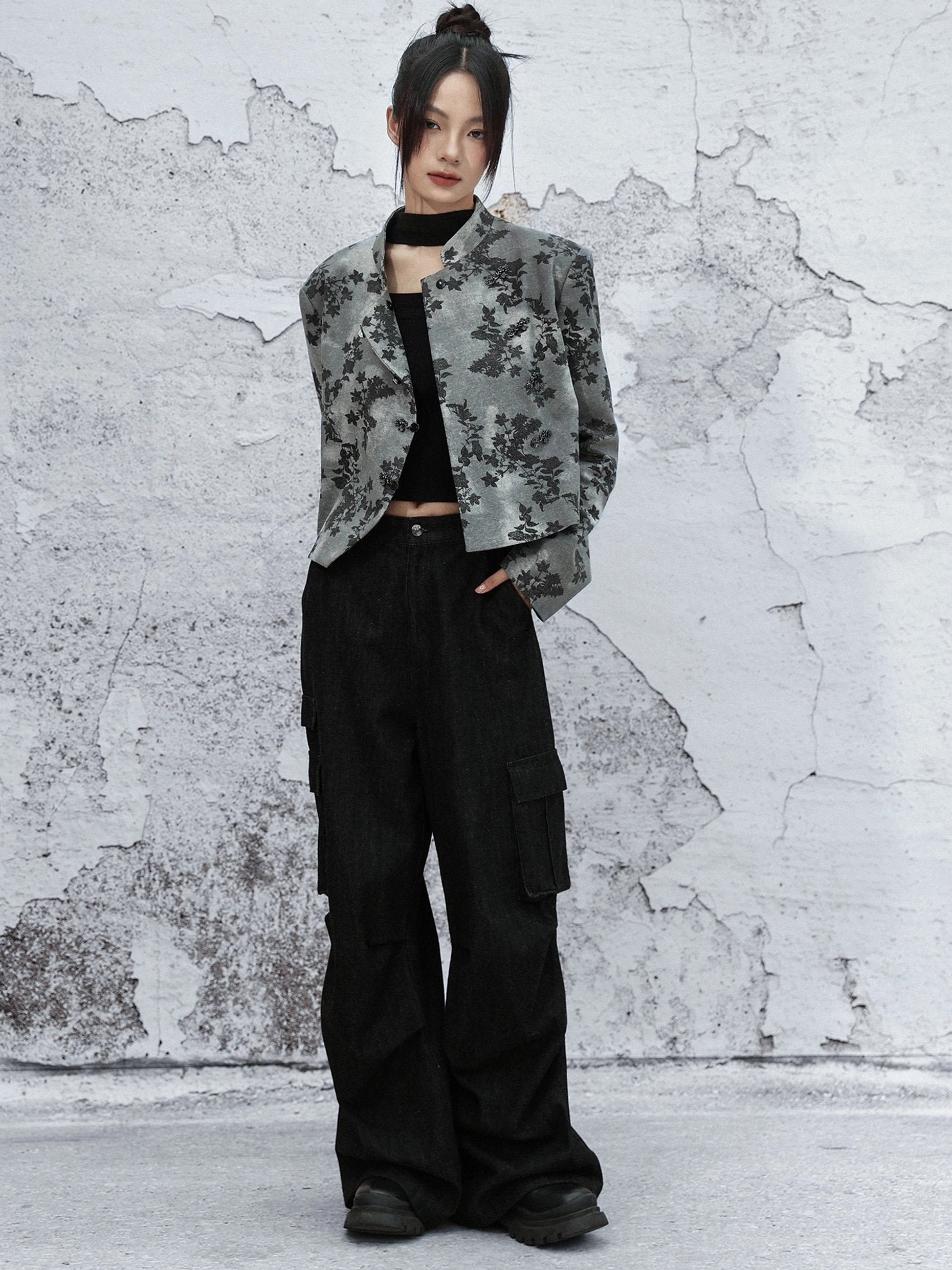 Full-body front view of grey and black botanical print Modern Hanfu cropped stand collar jacket with black turtleneck and cargo pants