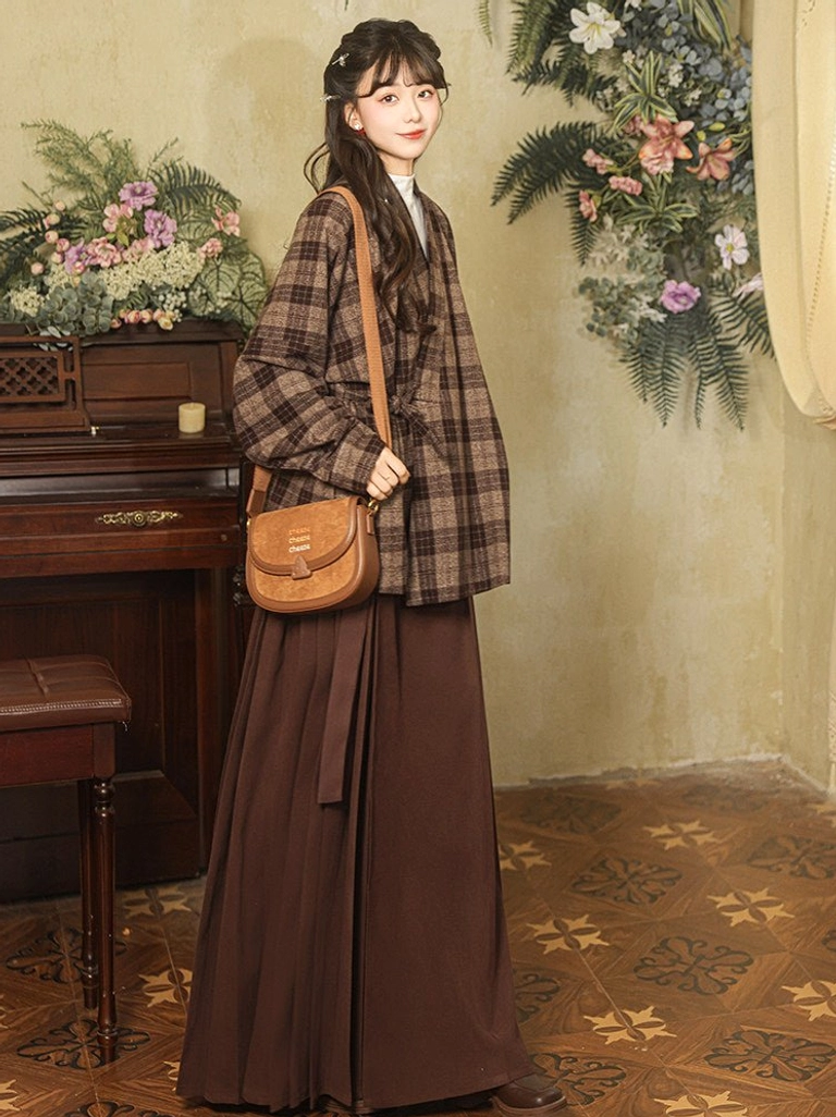 Modern Hanfu grey brown plaid wrap jacket side view styled with a leather shoulder bag and pleated skirt