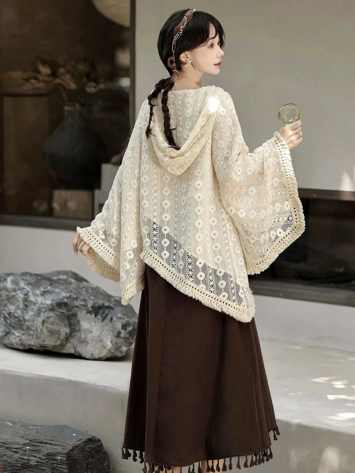 Back three-quarter view of modern Hanfu clothing showing the hooded beige lace top, crocheted hem trim, and layered styling with a deep brown skirt