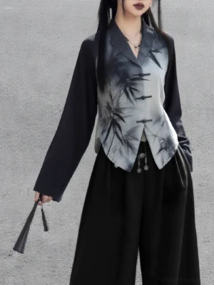 Front three-quarter view of a modern Hanfu ink bamboo long sleeve top with contrasting black sleeves, frog fasteners, waist pendant decoration, and folding fan styling