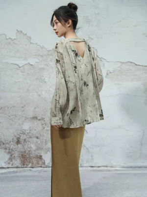 Back and side view of modern Hanfu ink print V-neck shirt showing open-back cutout and long tied neck sash
