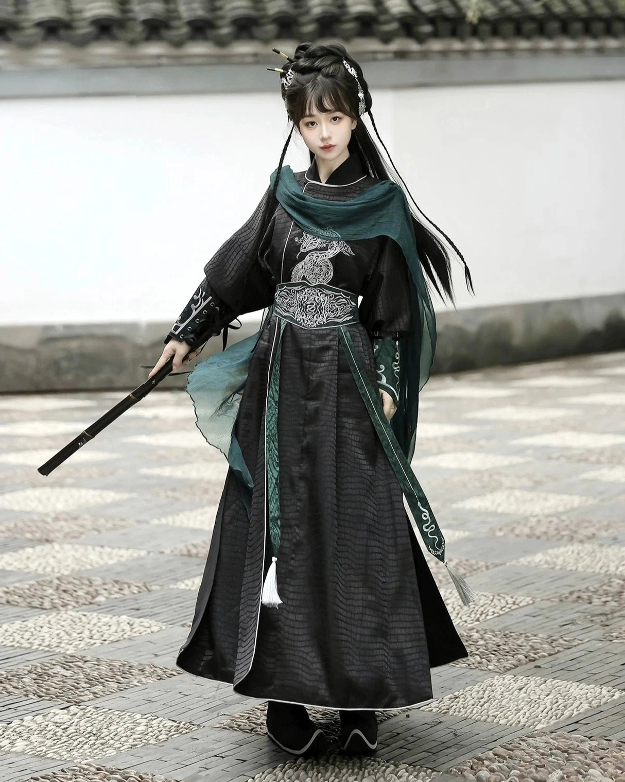 Modern Hanfu knight costume in black and dark green with coordinated silver embroidery, wrist guards, layered robe, and fantasy warrior styling