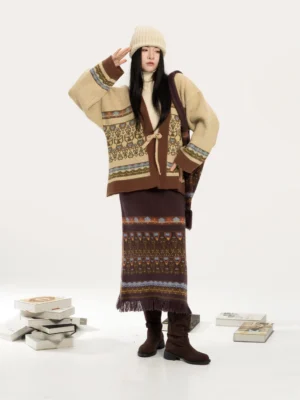 Modern Hanfu knitted cardigan and jacquard midi skirt set styled with a beige beanie and brown boots in a full-body front view