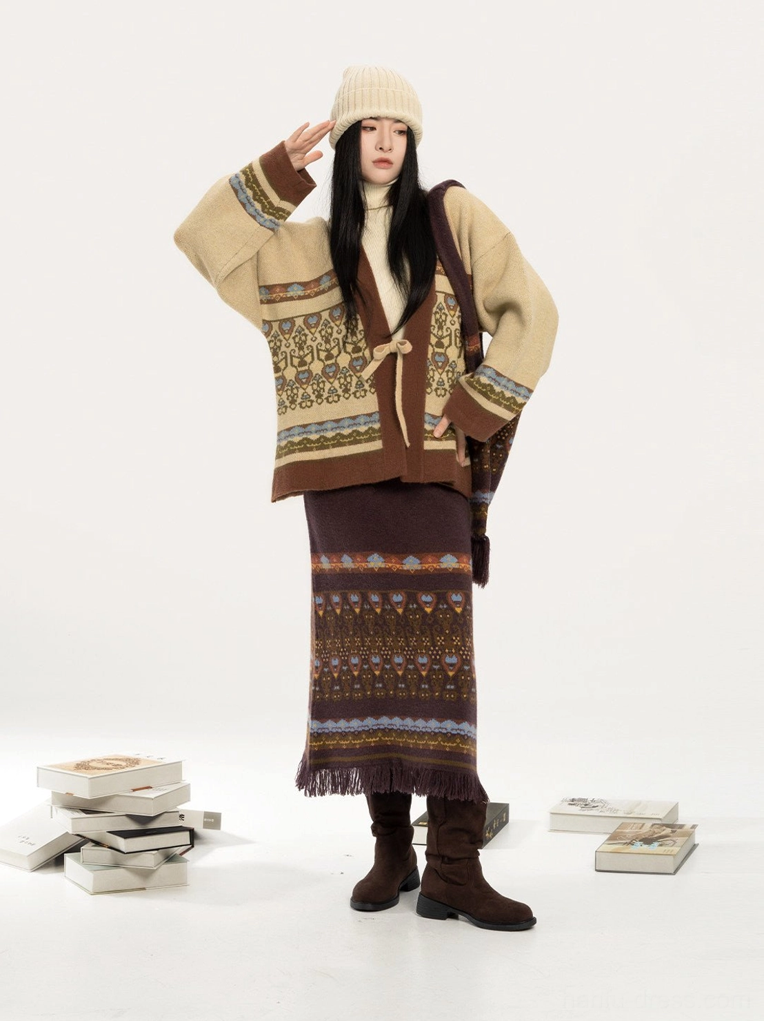 Modern Hanfu knitted cardigan and jacquard midi skirt set styled with a beige beanie and brown boots in a full-body front view