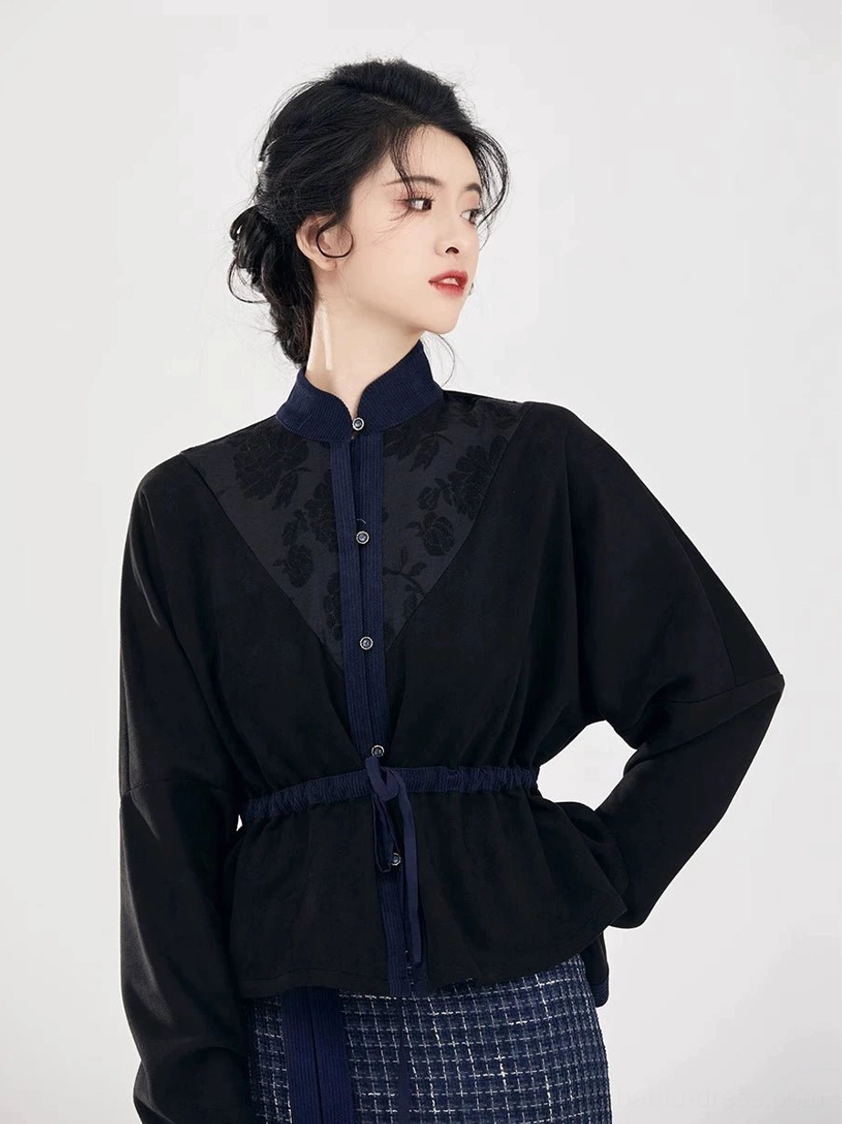 Close up of modern hanfu long sleeve top with stand collar front buttons floral embroidery and adjustable drawstring waist