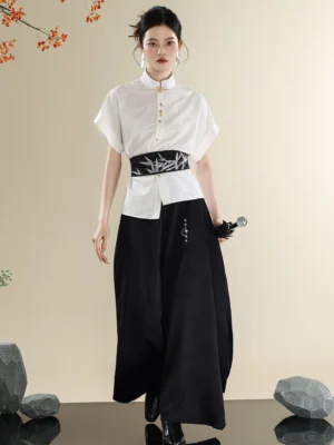 Full front view of a modern Hanfu outfit with white Mandarin collar shirt, black bamboo embroidered waist sash, and flowing black wide-leg trousers