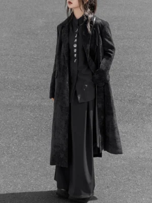 Full body styling of a black moon phase modern Hanfu top layered under a long fuzzy coat with wide-leg trousers for a dark urban outfit