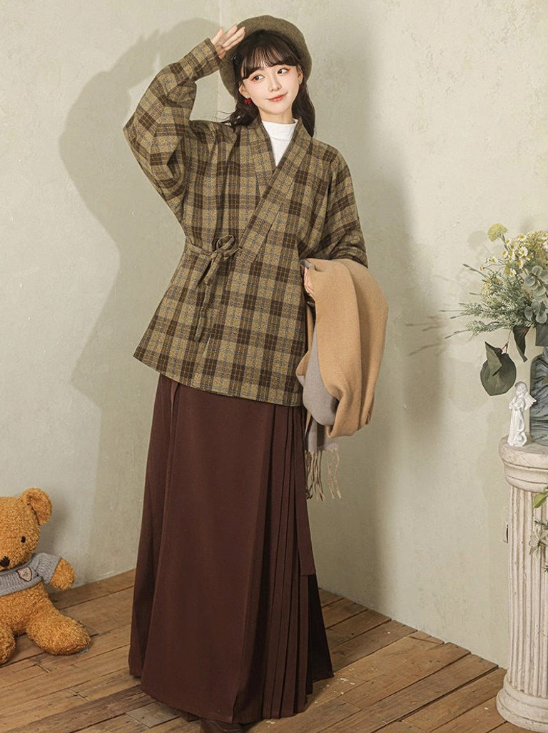 Modern Hanfu olive brown plaid cross-collar wrap jacket front view styled with a dark pleated long skirt and beret