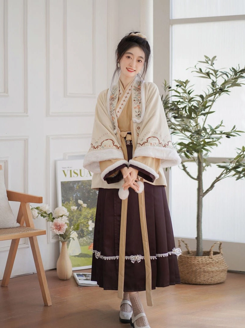 Full-body Modern Hanfu outfit showing embroidered beige cardigan with fluffy cuffs, cream waist ribbons, cross-collar top, and classic burgundy mamian skirt