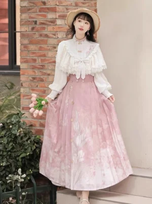 Angled full-body view of a modern Hanfu outfit featuring a soft pink floral mamian skirt, white ruffled top, pearl waist chain, straw hat, and tulip bouquet