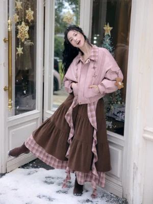 Modern Hanfu pink cropped jacket and brown ruffle midi skirt outfit shown from the side at a French-style shop door with plaid collar and layered skirt sash