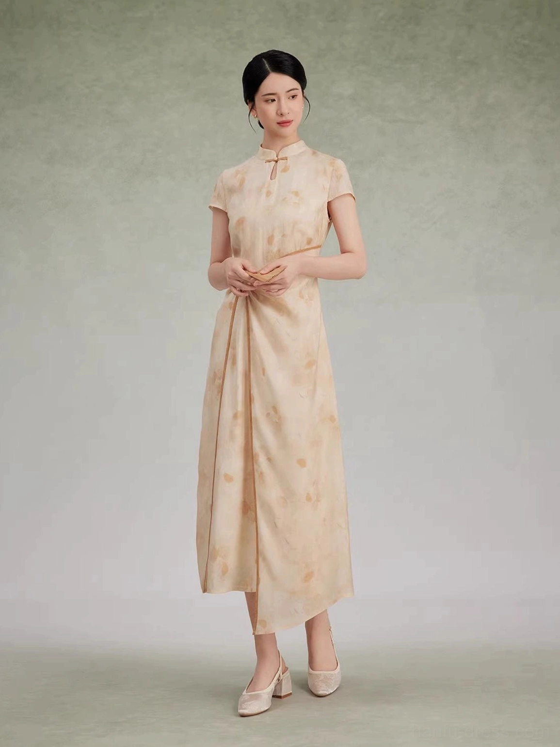 Modern Hanfu qipao dress front view with subtle floral print, cap sleeves, fitted silhouette and uneven hem