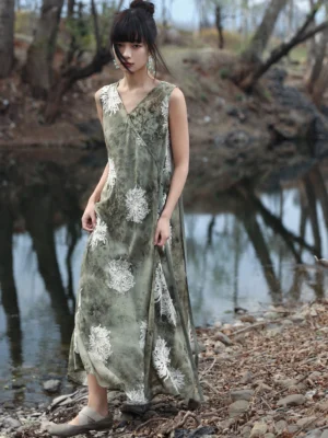Front full-body view of a sage green modern Hanfu tie-dye floral maxi dress with chrysanthemum print, wrap V-neck, sleeveless design, and flowing floor-length silhouette