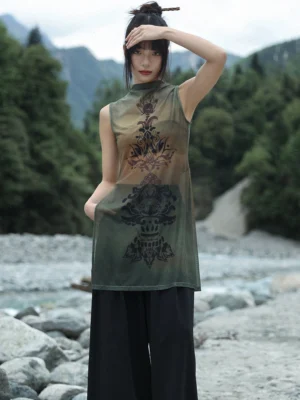 Front three-quarter view of a Chinese-style sheer mesh sleeveless tunic top featuring dark Tang-inspired oriental prints, earthy gradient fabric, high collar, and flowing modern Hanfu silhouette