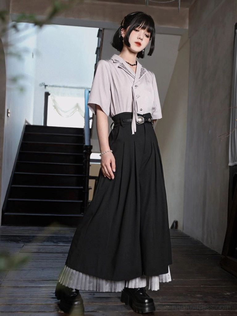 Modern Hanfu short sleeve embroidered shirt tucked into a long pleated maxi skirt with vintage accessories and platform loafers
