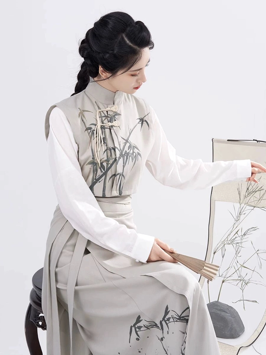 Side seated view of a modern Hanfu outfit showing the flowing spiral wrap skirt, bamboo print hem, and elegant Song Dynasty silhouette