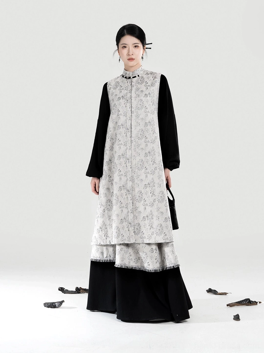 Full body front view of modern Hanfu set featuring stand collar floral bijia vest black top and matching layered A-line skirt