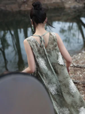 Back close-up view of a Chinese-style summer maxi dress showing the crisscross back straps, adjustable tie closure, and exposed back detail