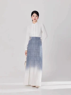 Modern Hanfu two-piece outfit shown from the front with a refined white long-sleeve blouse and flowing ombre pleated skirt