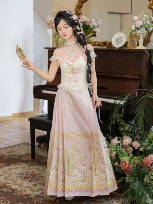 Modern Hanfu Waltz outfit beside a vintage piano, showing the cream floral embroidered corset top and flowing pink floor length Ming style mamian skirt