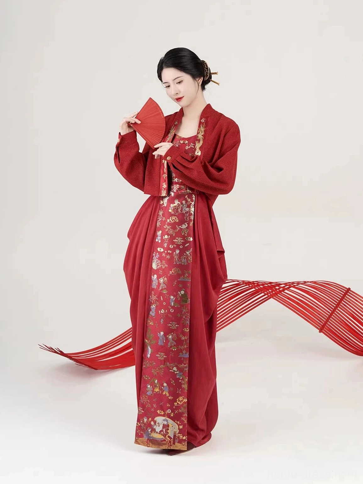 Modern Hanfu wedding tea ceremony dress and cropped coat set side view styled with red folding fan
